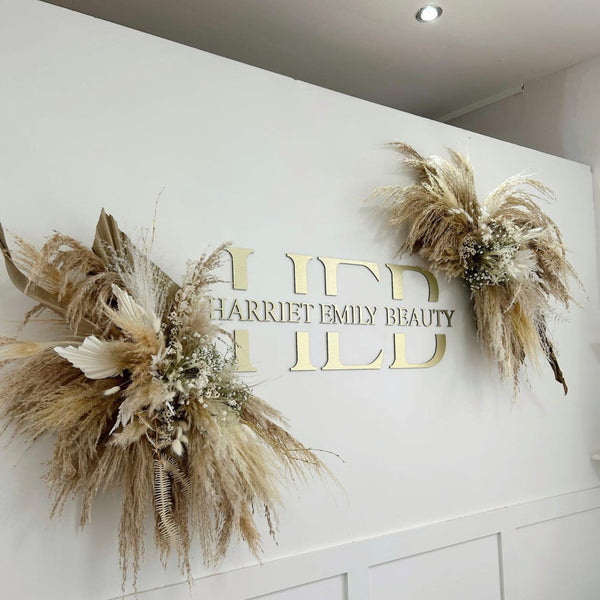 champagne-tone wall sign for high-end beauty salon London