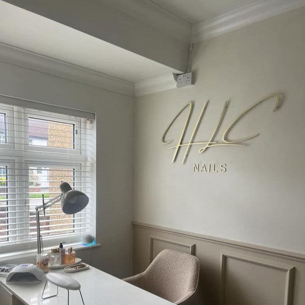 custom brushed gold clinic reception sign manufactured UK